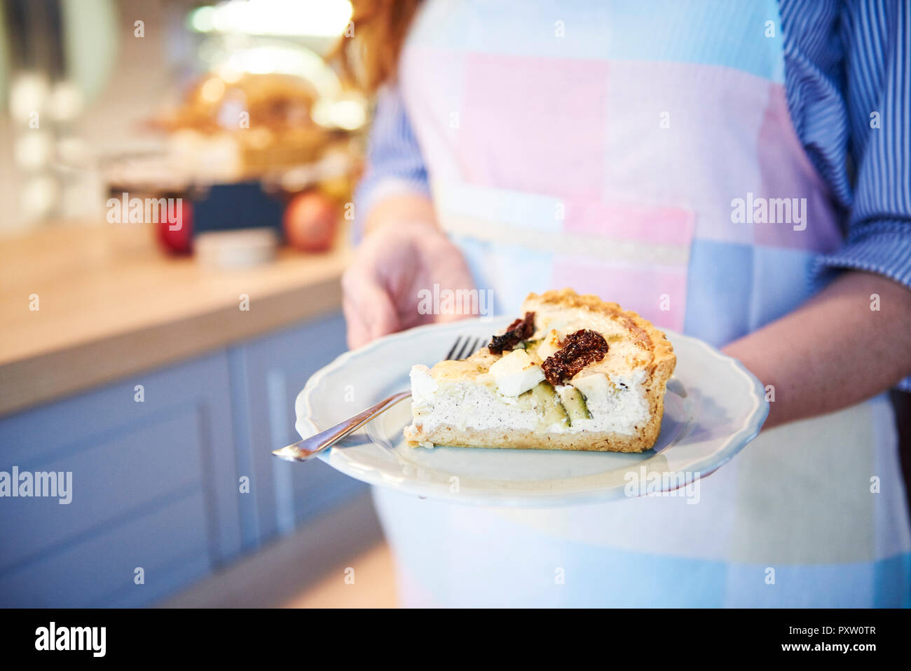 Close-up of woman serving cake in a cafe Stock Photo