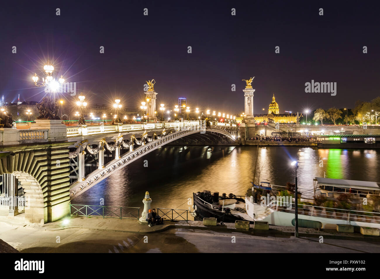 France, Paris, Pont Alexandre III bridge, Seine river at night Stock Photo