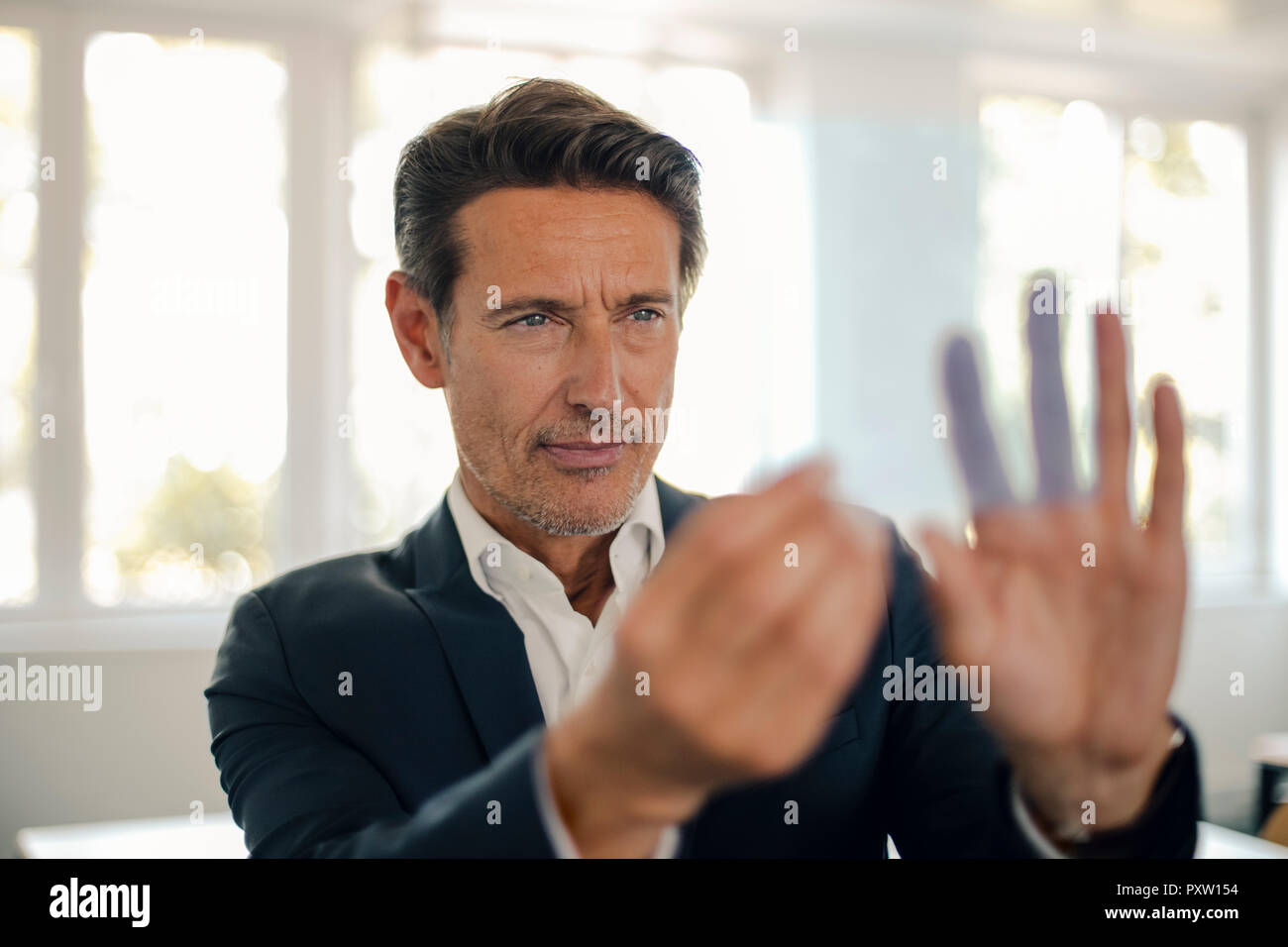 Businessman using futuristic touch screen Stock Photo