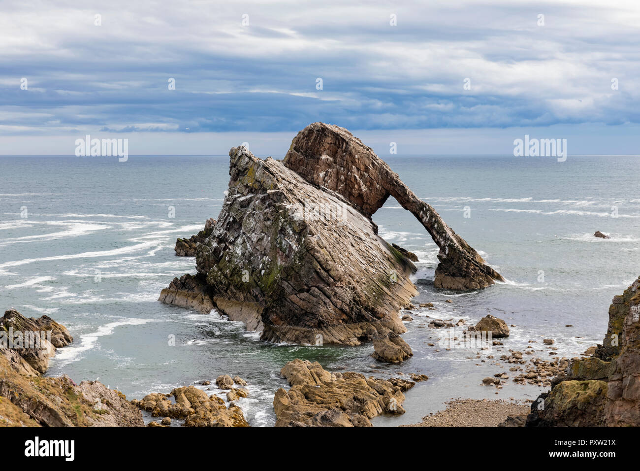 UK, Scotland, Portknockie, Bow Fiddle Rock natural arch Stock Photo