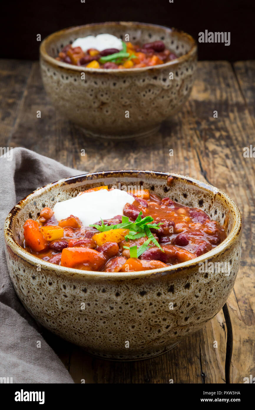 Chili con Carne with coriander and sour cream Stock Photo Alamy