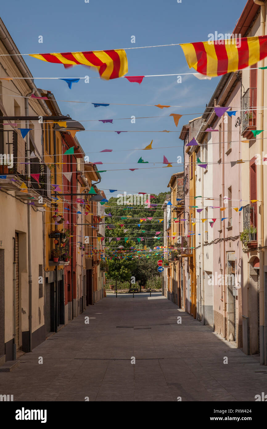 Spain, Catalonia, alley with Catalonian flags Stock Photo
