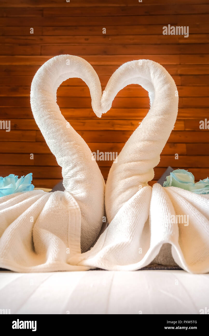 Love concept honeymoon bed in soft focus Stock Photo