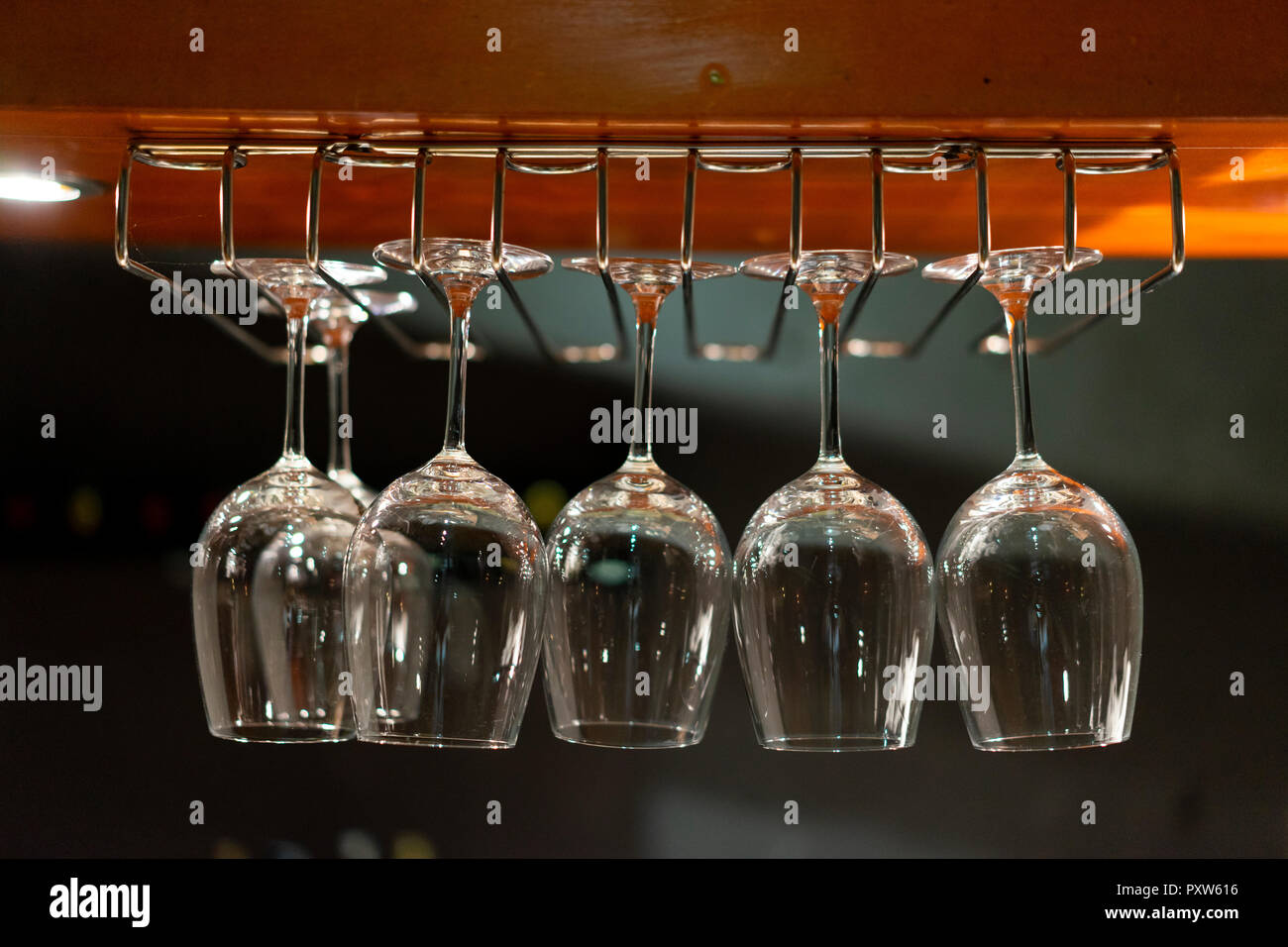 Wine glasses hanging from ceiling in a restaurant Stock Photo Alamy
