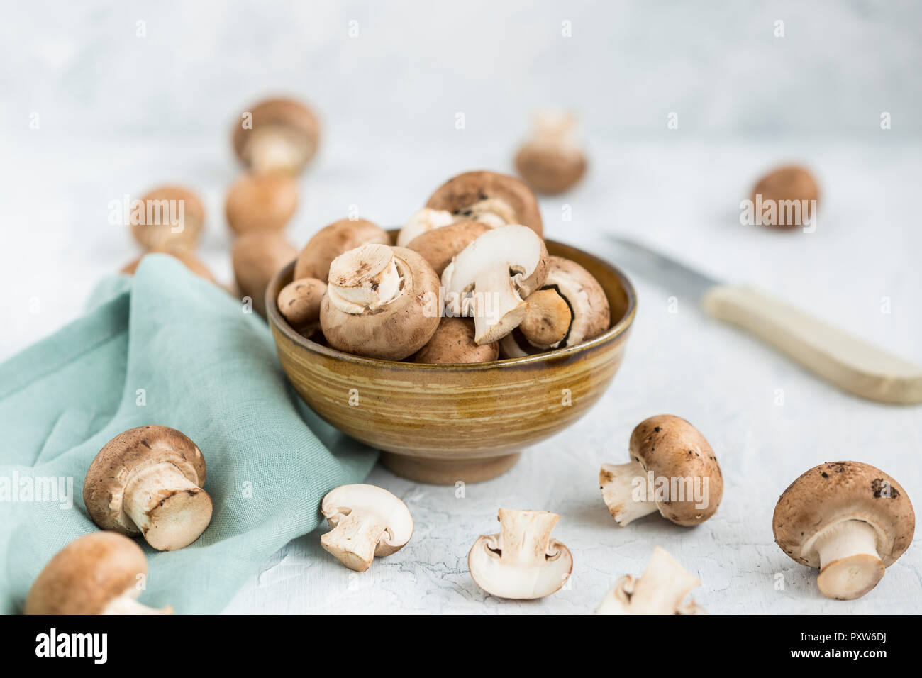 Bowl of sliced and whole Crimini Mushrooms Stock Photo