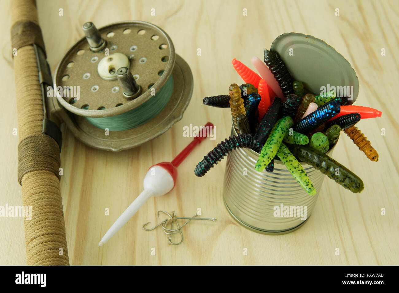 Close-up, detail, can, colourful artificial worms, fishing equipment, catch fish, rod, reel Stock Photo