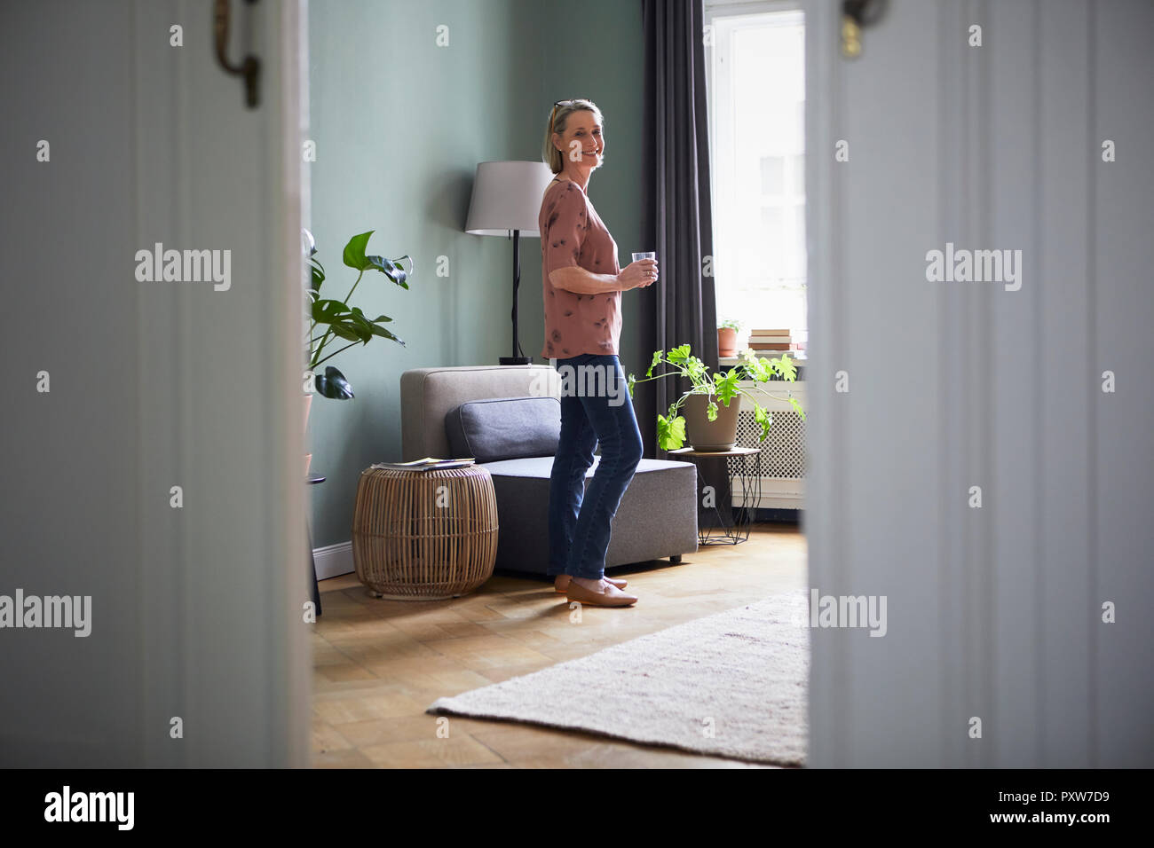 Portrait of smiling mature woman at home Stock Photo - Alamy