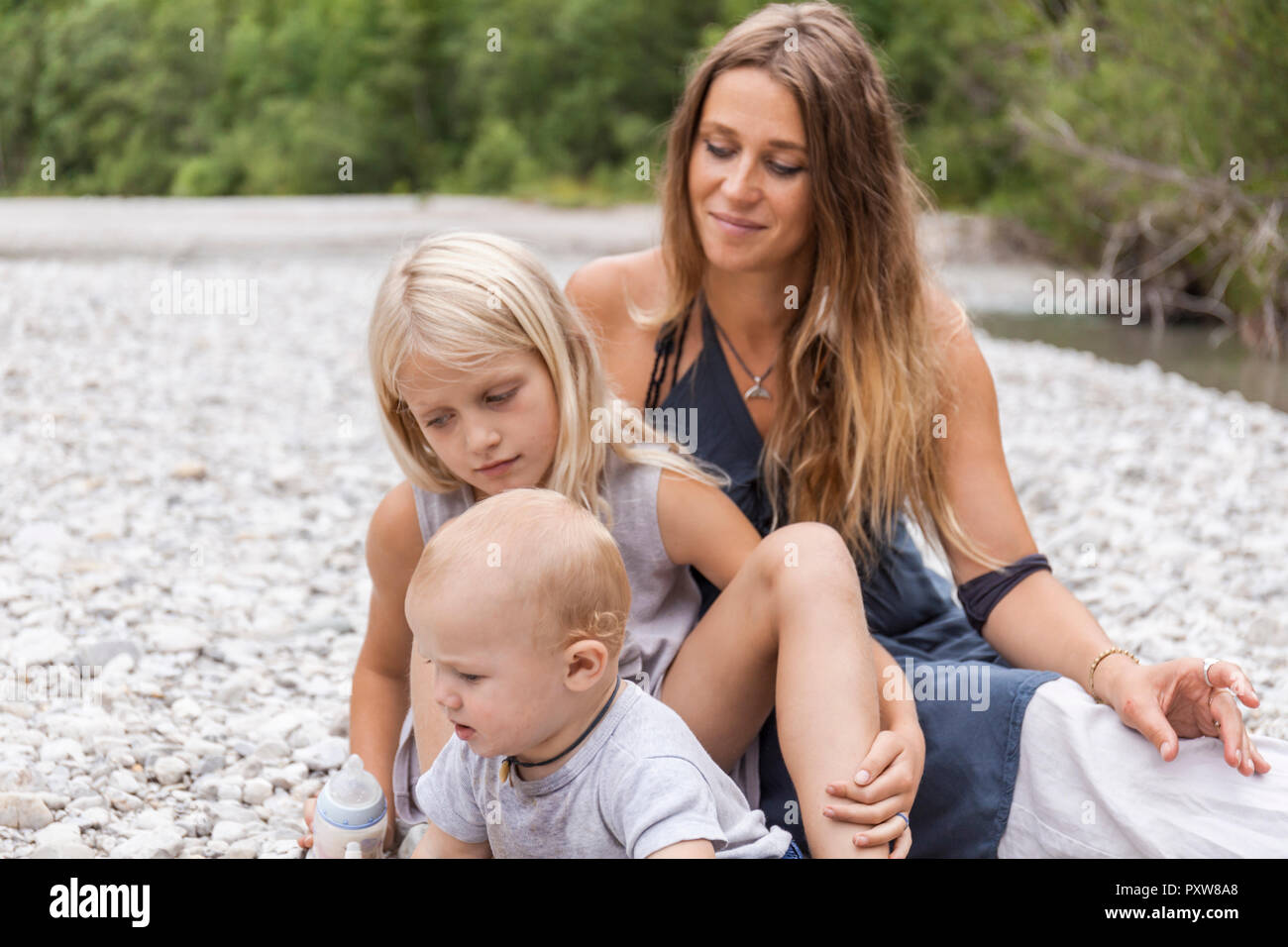 Mother with two children outdoors in the nature Stock Photo