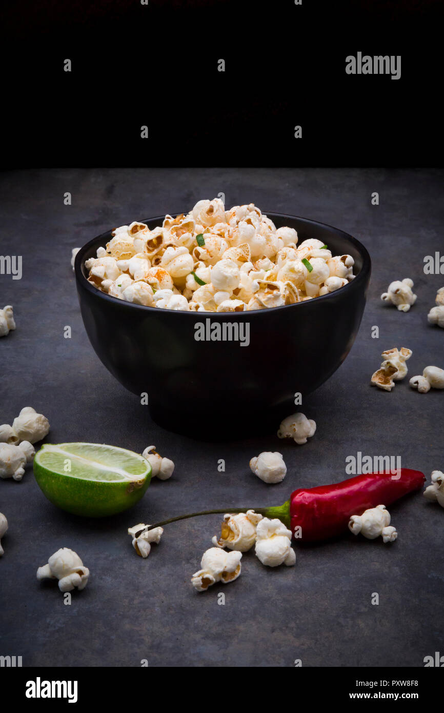 Bowl with popcorn flavoured with chili and lime Stock Photo