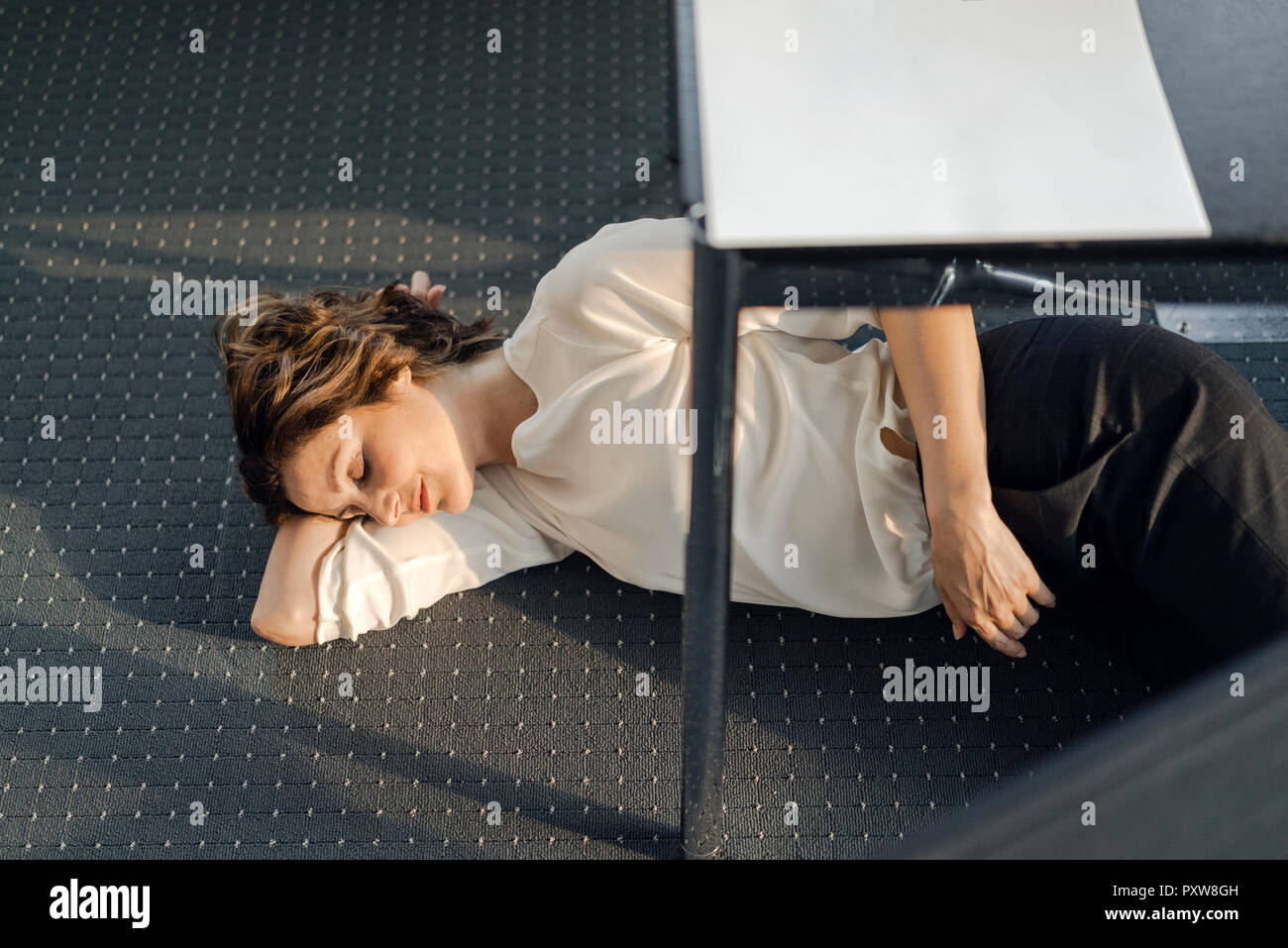 Sleeping under desk work hires stock photography and images Alamy
