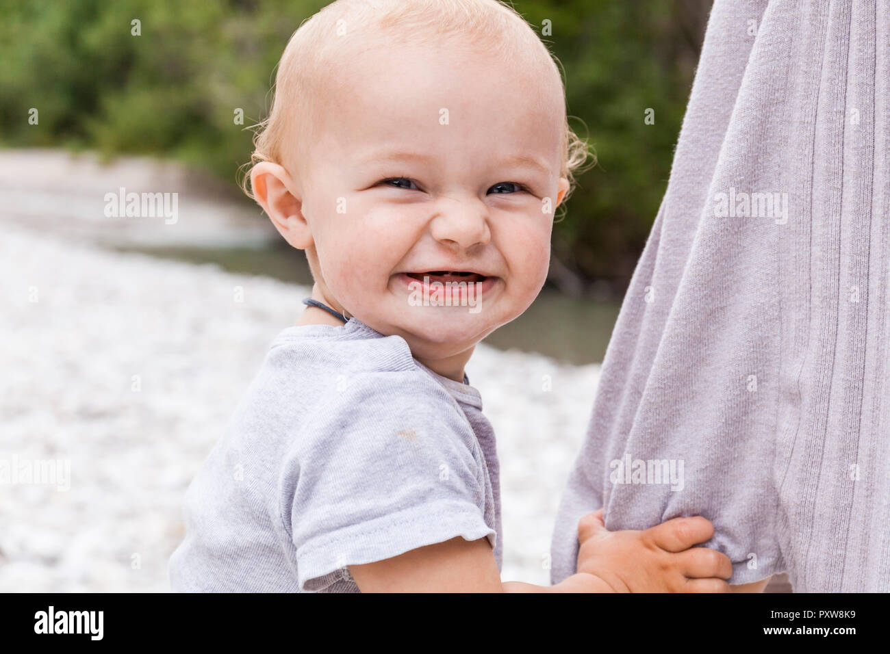 Portrait of happy baby boy outdoors Stock Photo