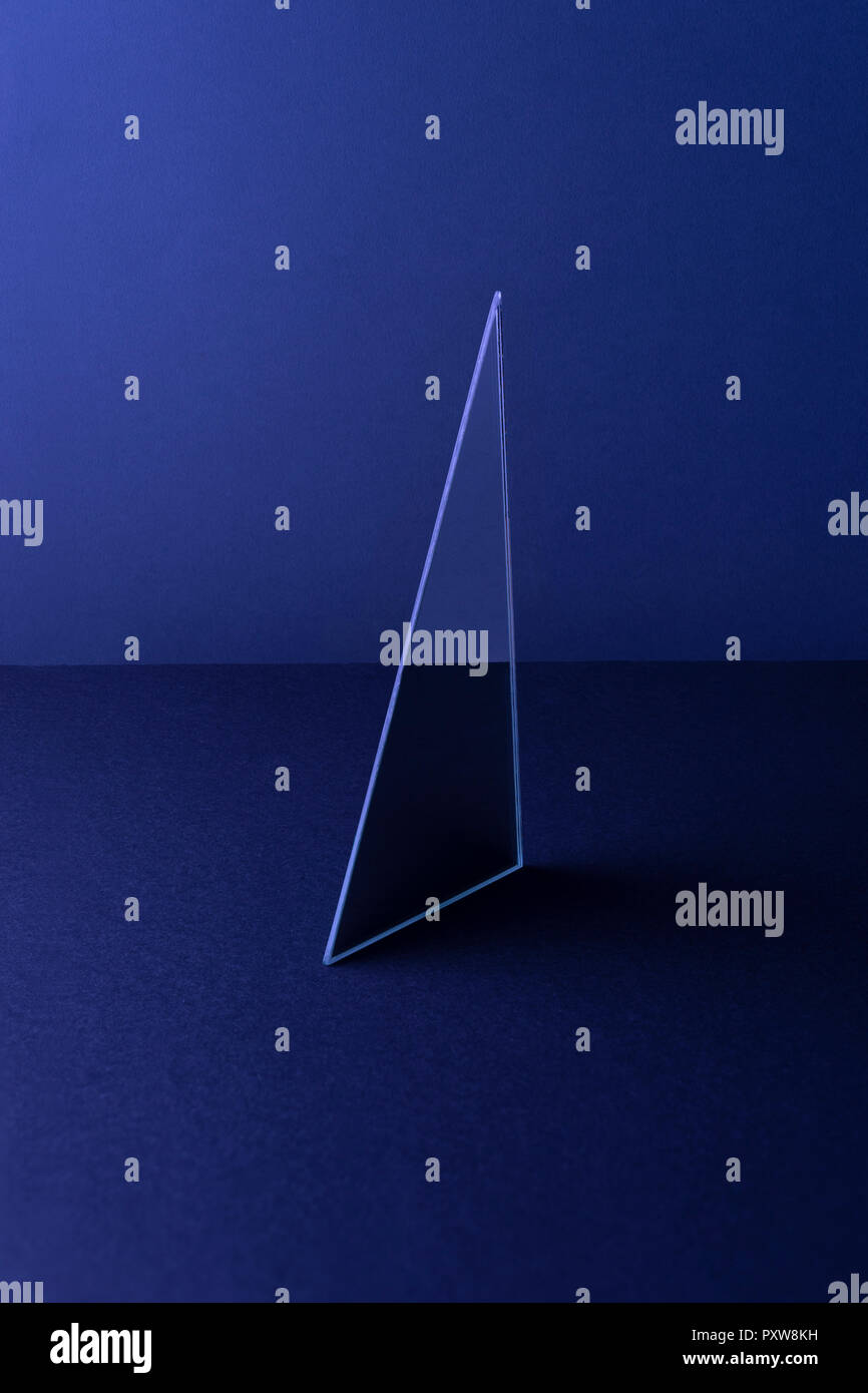 Triangle shaped mirror on dark blue ground, 3D Rendering Stock Photo ...