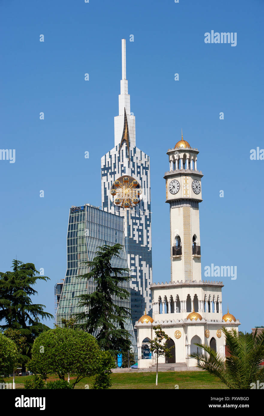 Georgia, Adjara, Batumi, Miracle Park, Chacha Clock Tower and technical university with big wheel in the tower Stock Photo