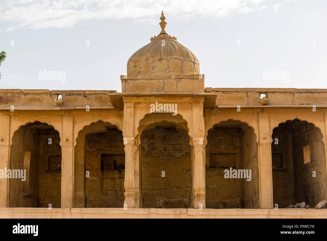 A building with arches near the Gadisar lake in the desert city of Rajasthan in India Stock Photo