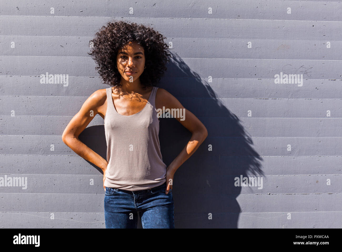 Portrait of young woman with curly hair Stock Photo