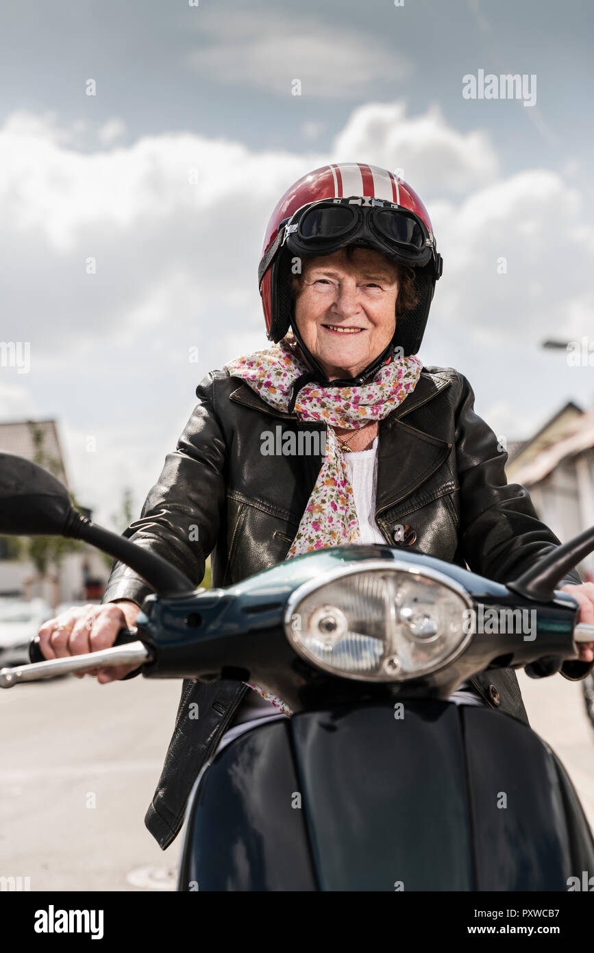Lady in scooter hires stock photography and images Alamy