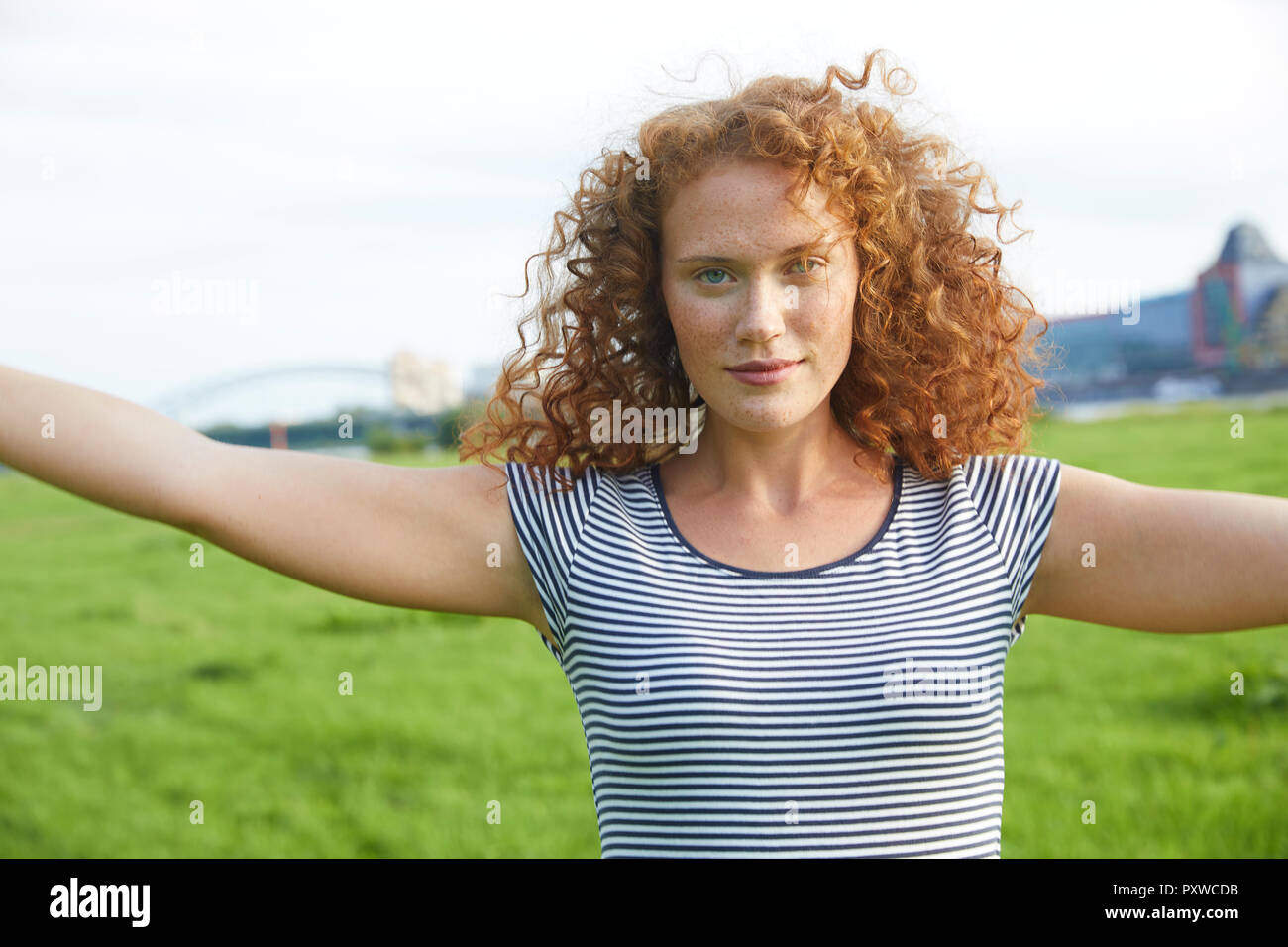 Portrait of smiling young woman  on a meadow in summer Stock Photo