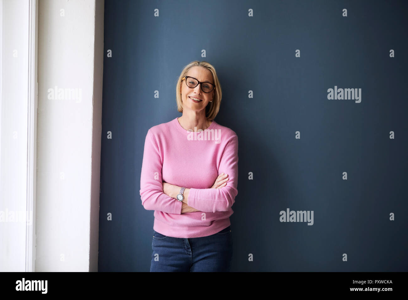 Portait of confident mature woman at home Stock Photo