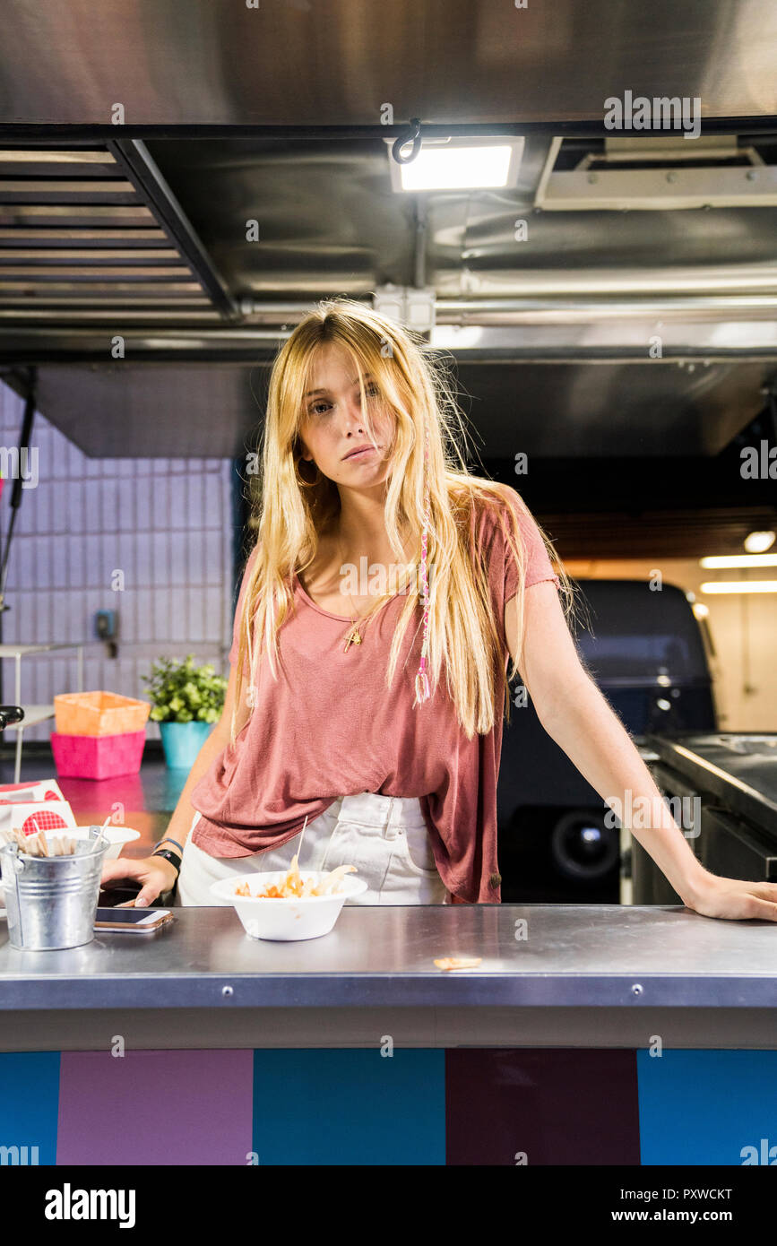 Portrait of young woman in a food truck Stock Photo