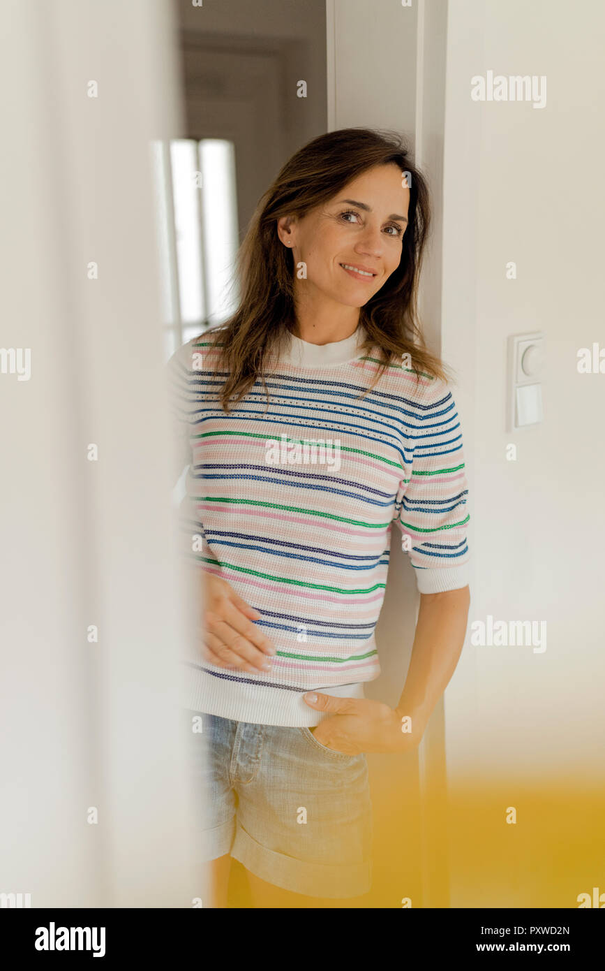 Portrait of smiling mature woman at home Stock Photo - Alamy