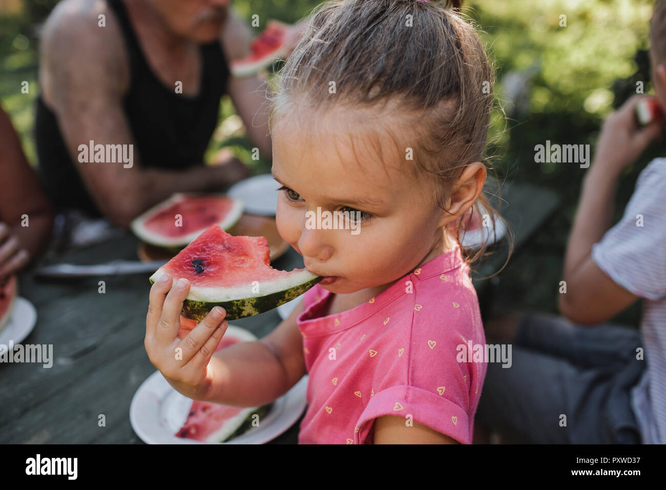 Portrait of little girl eating watermelon Stock Photo