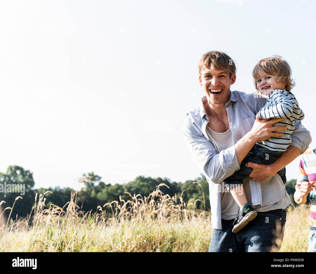 Father and son having fun at the river on a beautiful summer day Stock Photo