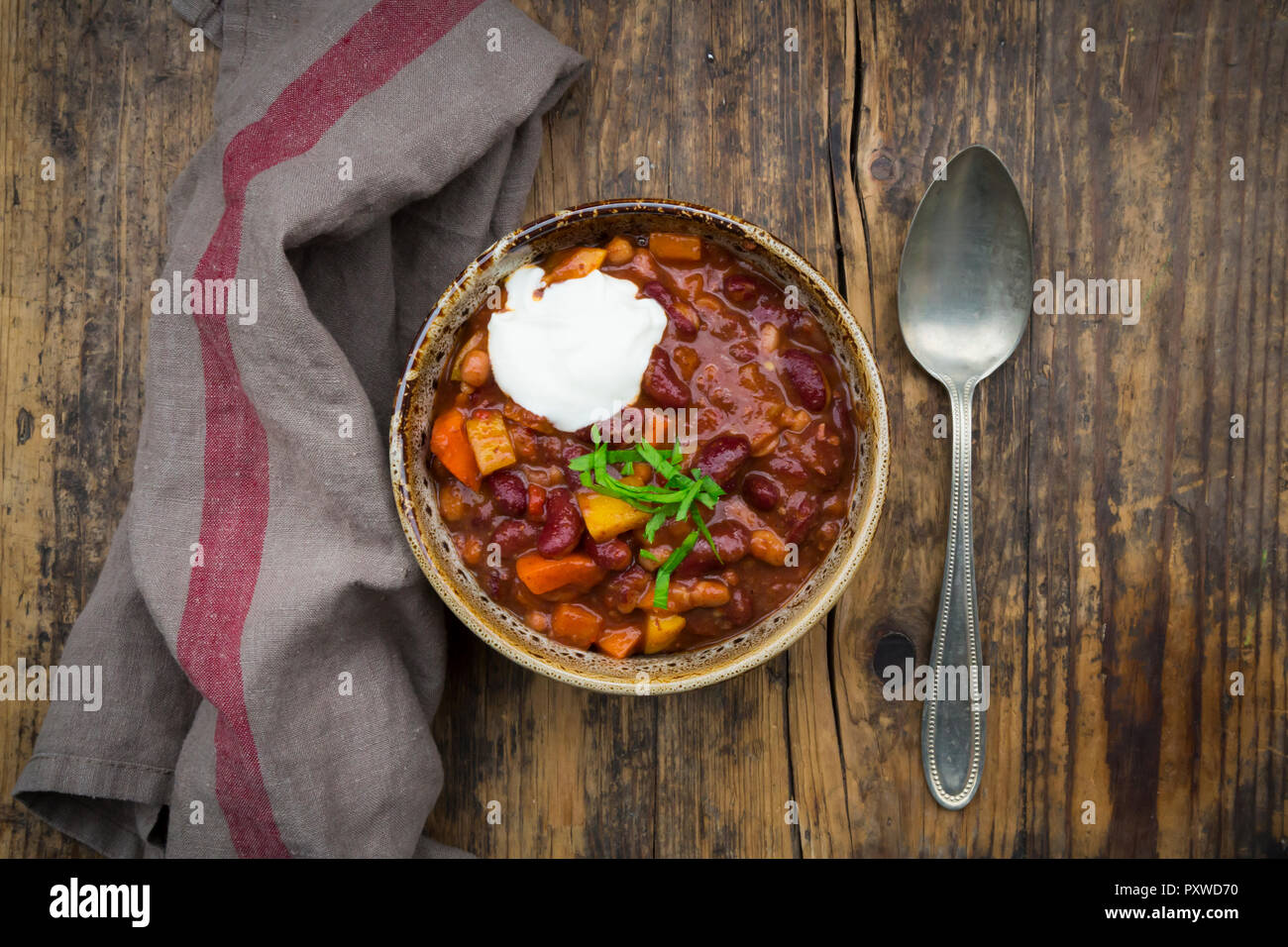 Chili con Carne with coriander and sour cream Stock Photo Alamy