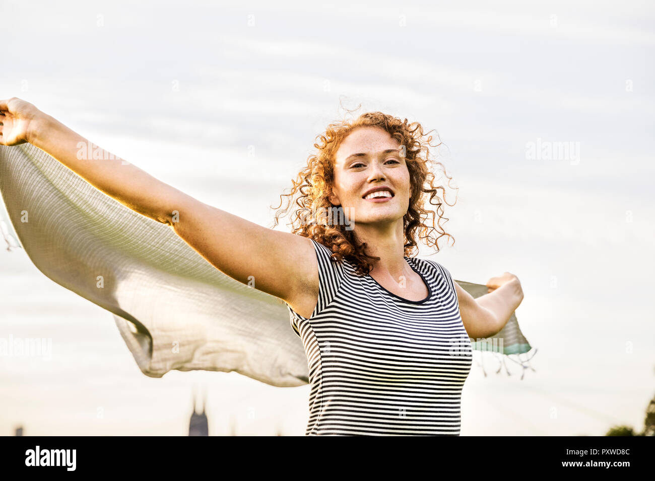 Germany, Cologne, portrait of happy young woman Stock Photo