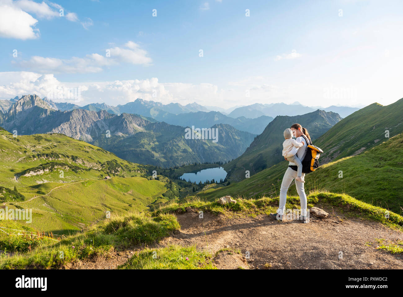 Germany, Bavaria, Oberstdorf, mother and little daughter on a hike in the mountains Stock Photo
