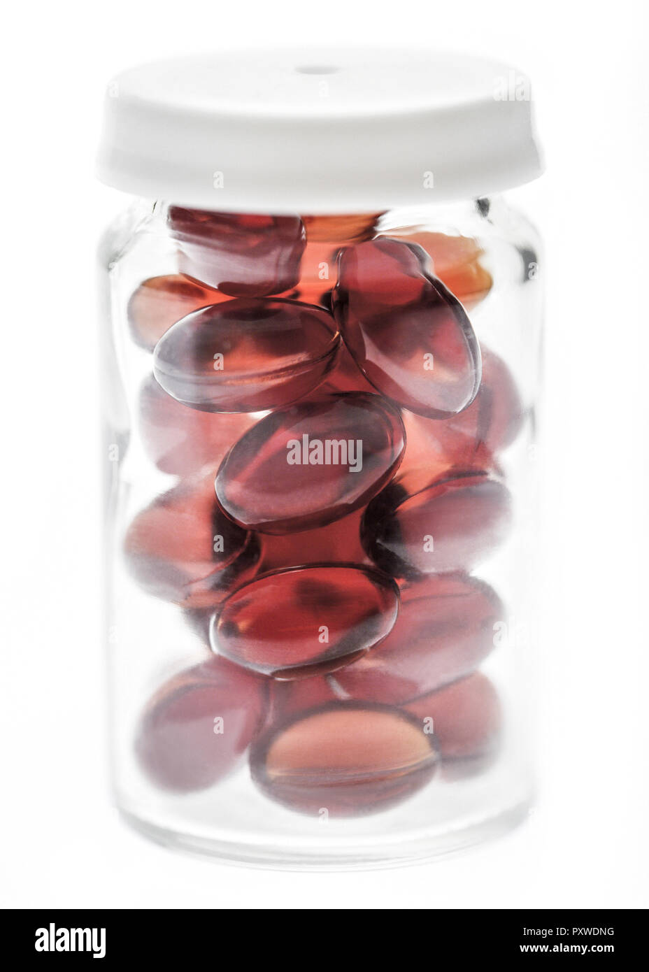 Rote Kapseln in Glas Stock Photo