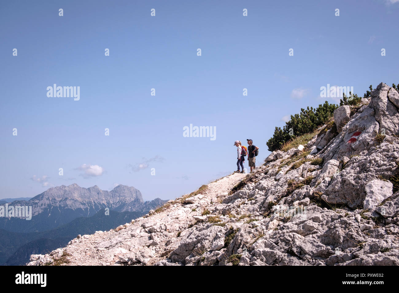 Austria, Salzburg State, Loferer Steinberge, brother and sister on a hiking trip in the mountains Stock Photo