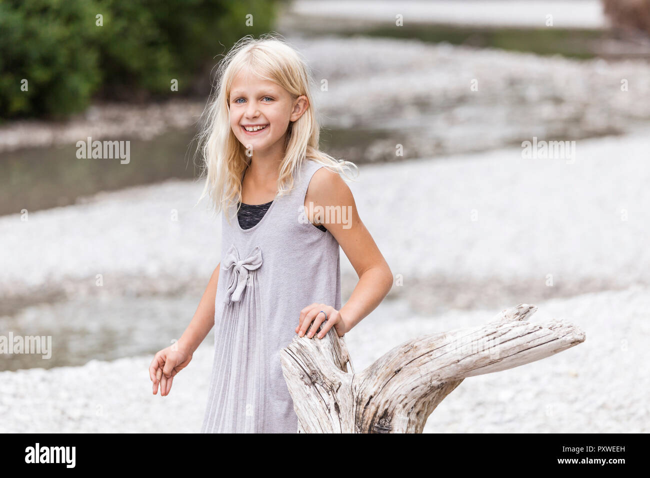 Portrait of smiling girl at the riverside Stock Photo