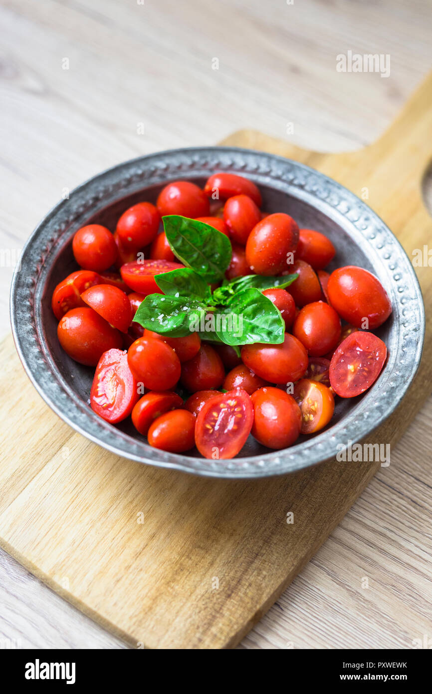 Tomatoes and basil in zinc bowl Stock Photo Alamy