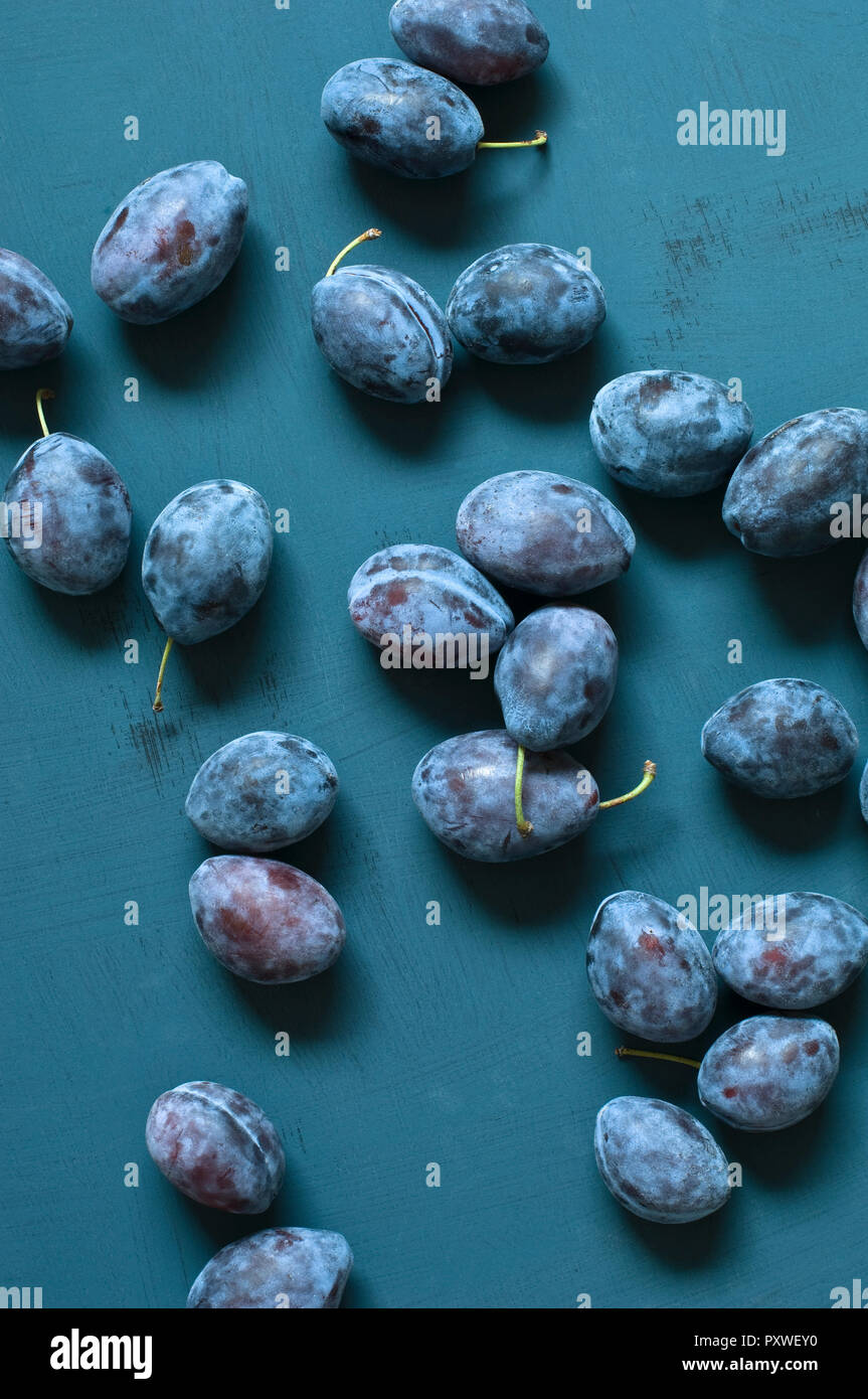 Plums on blue ground Stock Photo