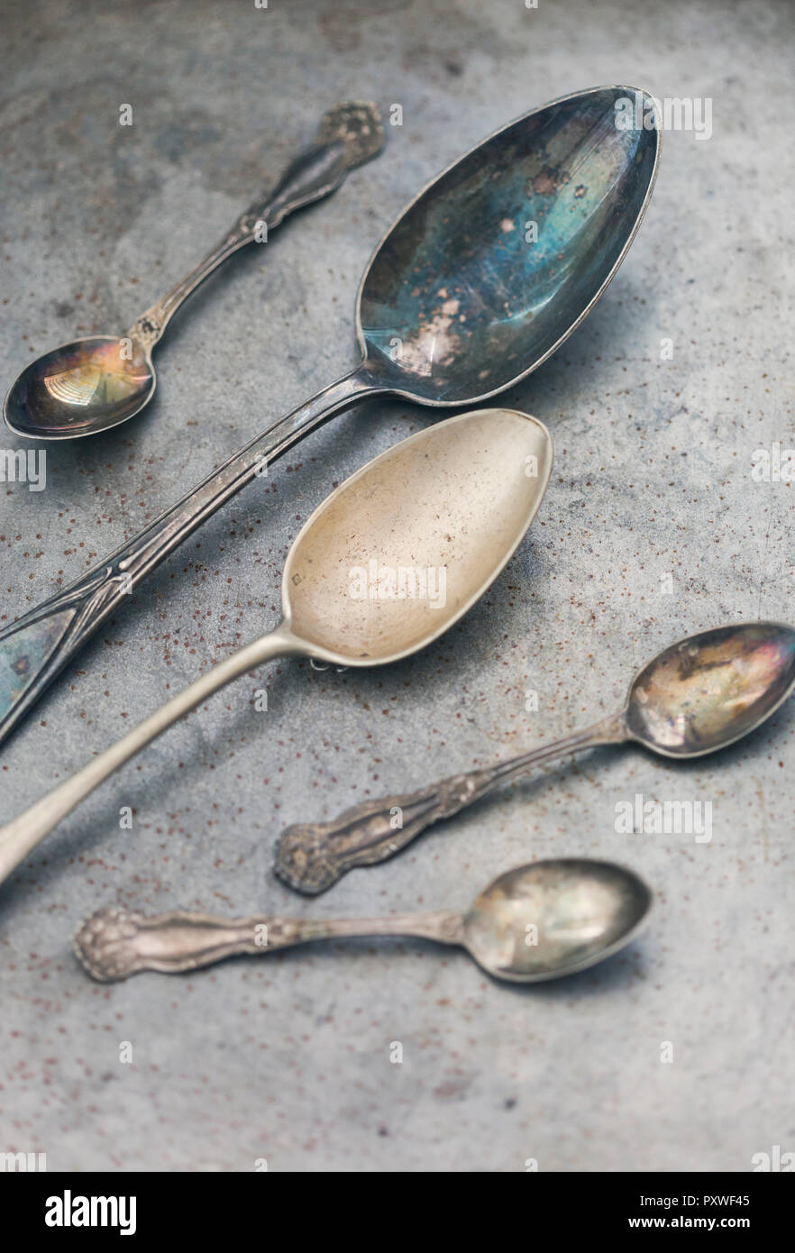 Old spoons on metal Stock Photo
