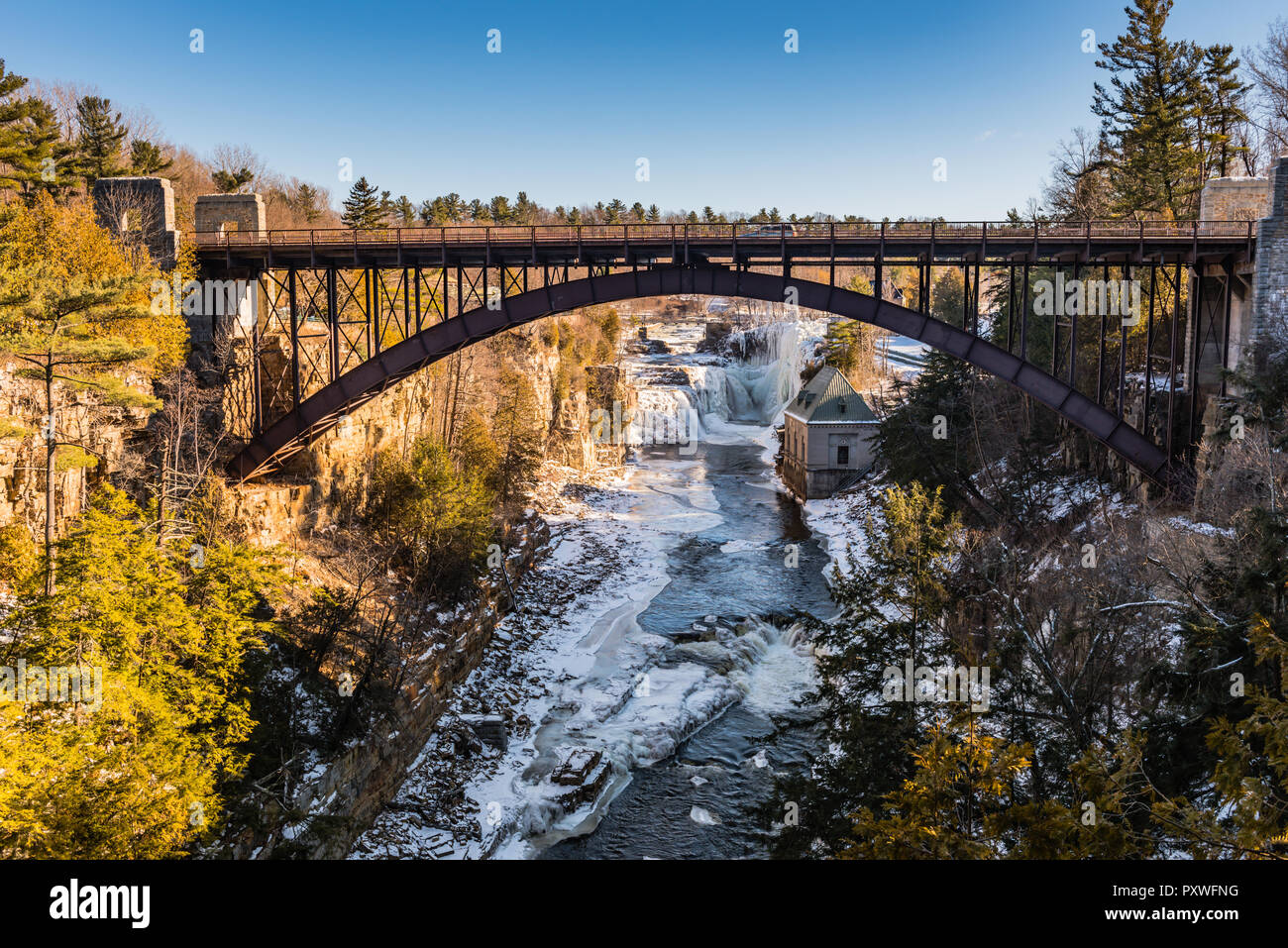 Iron bridge over Ausable River at Ausable Chasm, a 2 mile gorge in the Adirondacks of Upstate New York known as the Grand Canyon of the East. Stock Photo