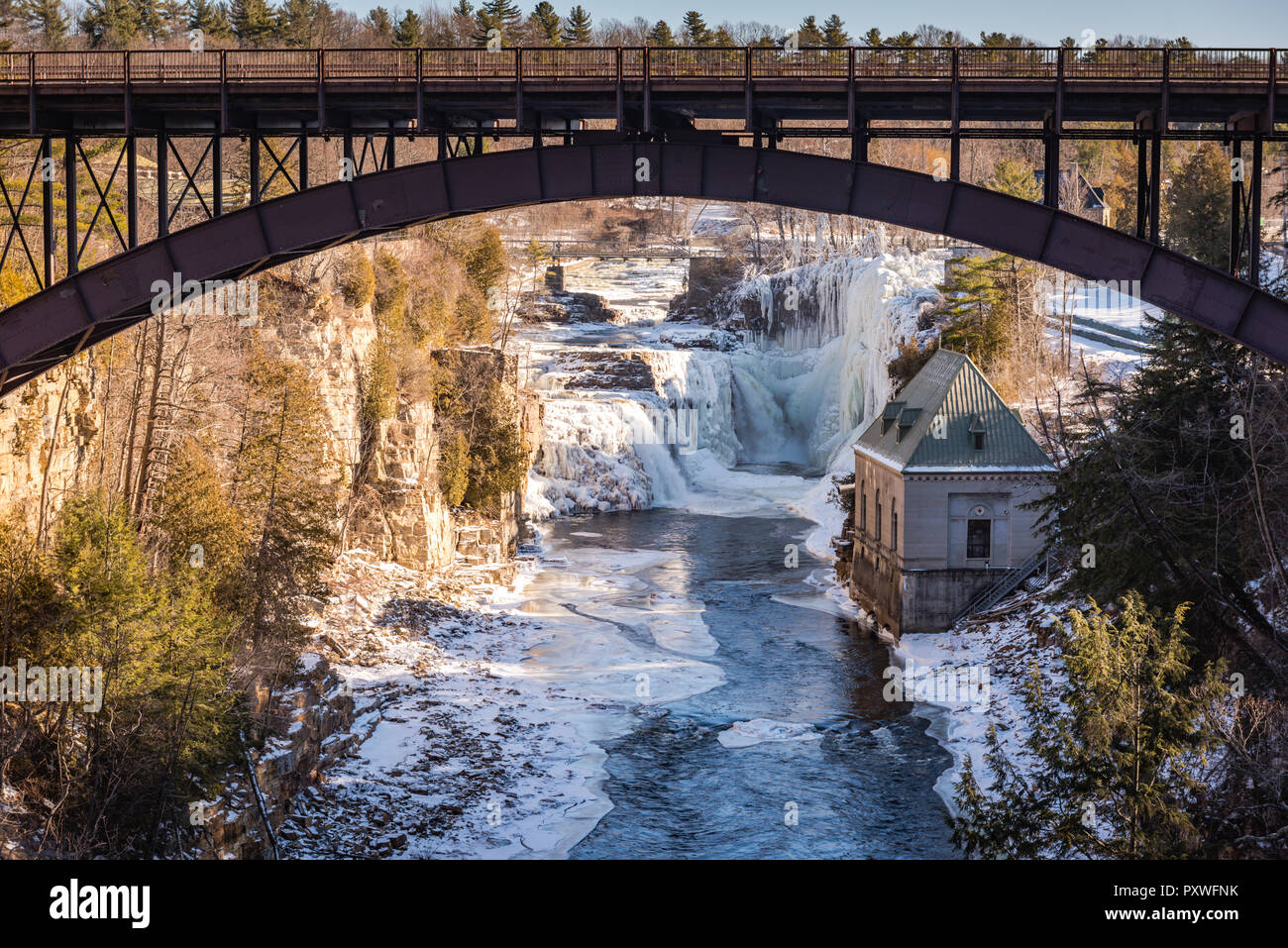 Iron bridge over Ausable River at Ausable Chasm, a 2 mile gorge in the Adirondacks of Upstate New York known as the Grand Canyon of the East. Stock Photo