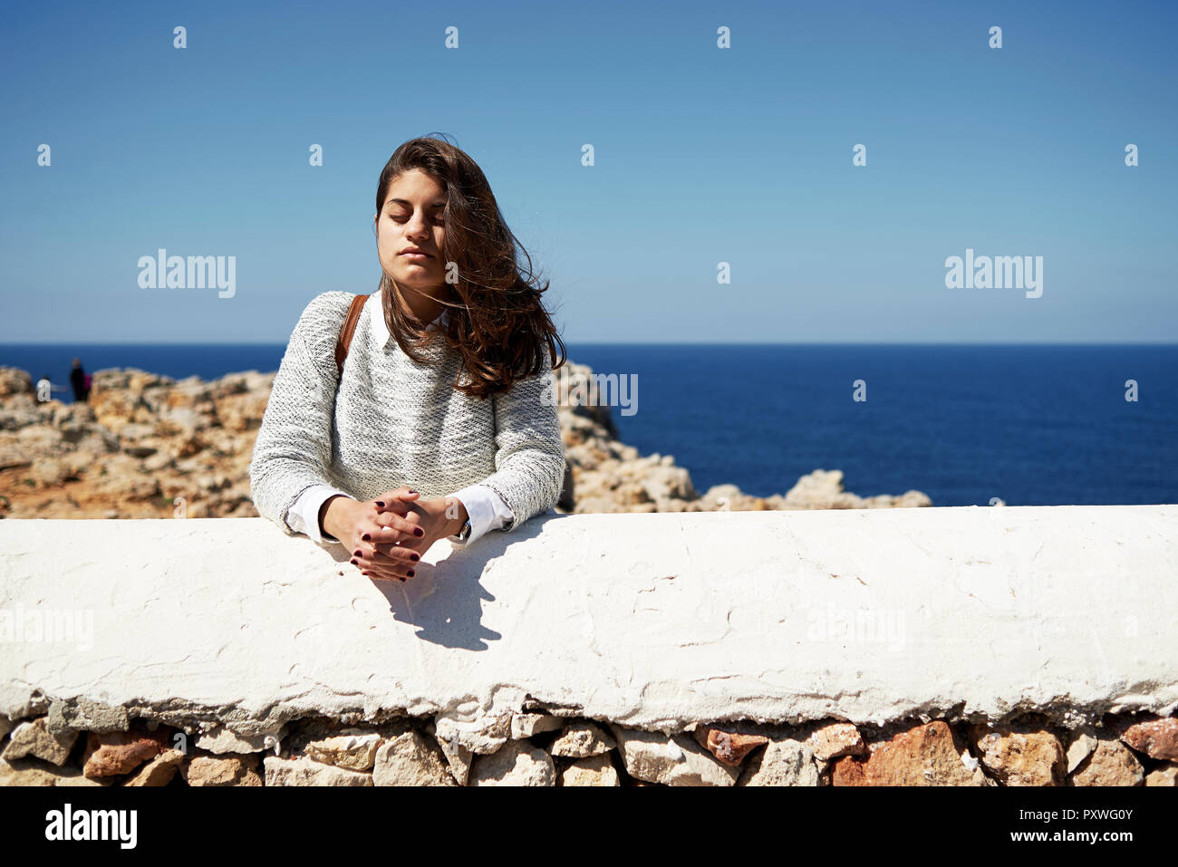 Feeling the wind, portrait of young brunette woman outdoor Stock Photo