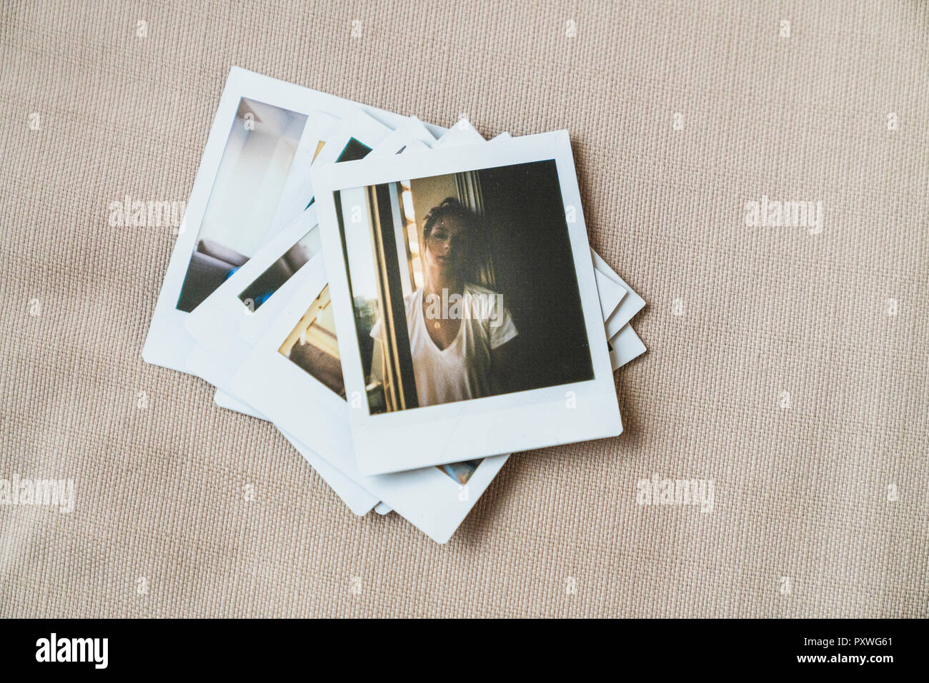 Stack of instant photos of young woman hi-res stock photography and ...