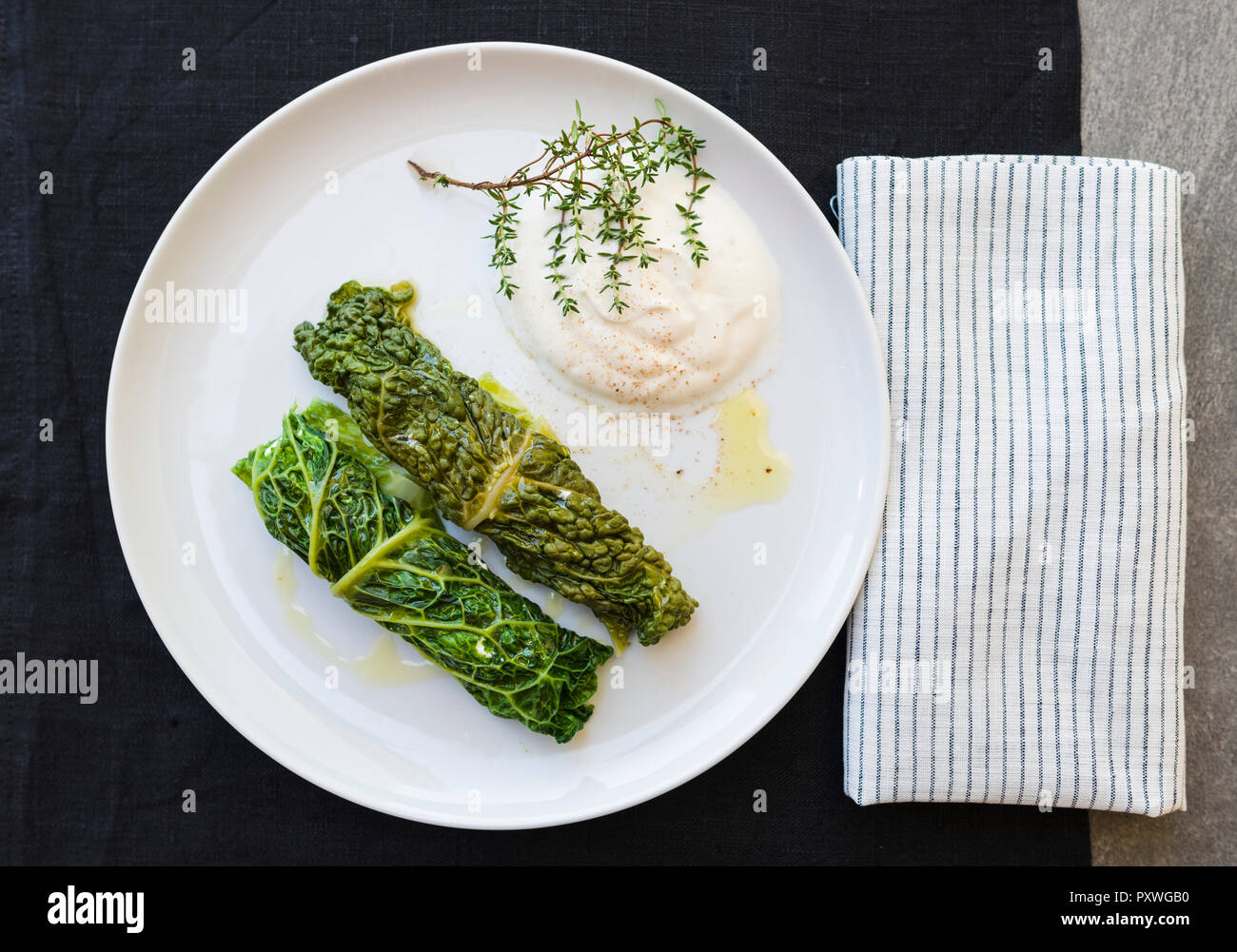 Two savoy cabbage rolls on plate Stock Photo