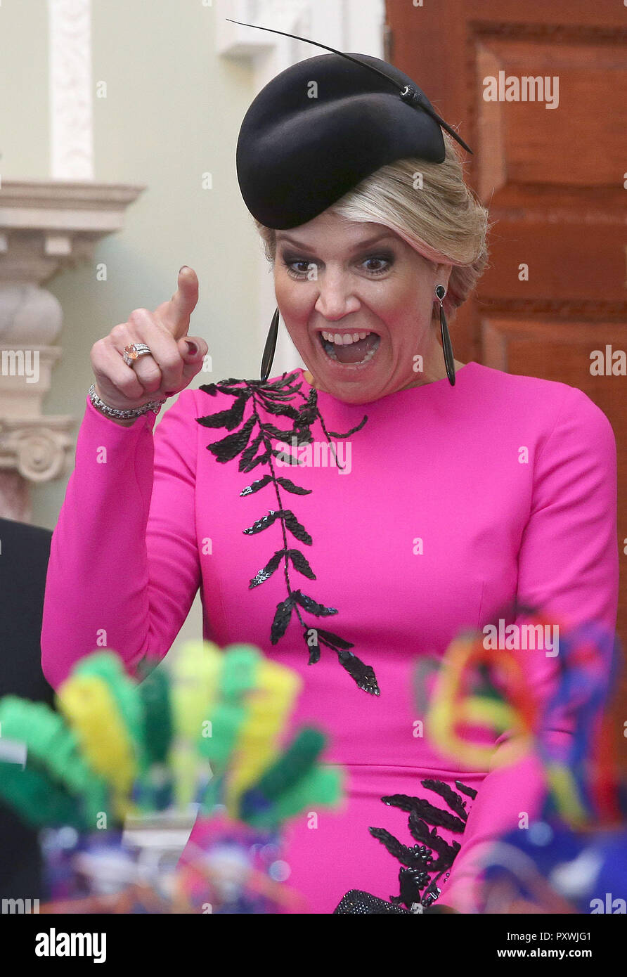 Queen Maxima of the Netherlands reacts as she interacts with school children as they work on the Ohbot, an educational robotics system, at the UK-Netherlands Innovation Showcase at Mansion House in London on the second day of her State Visit to the UK. Stock Photo