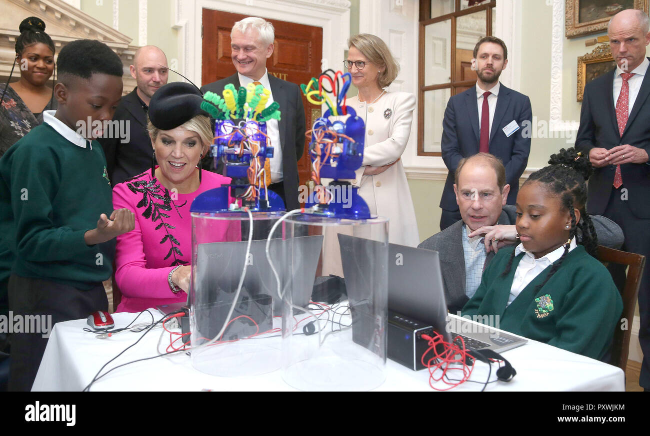 Queen Maxima of the Netherlands and the Earl of Wessex as they interact with school children as they work on the Ohbot, an educational robotics system, at the UK-Netherlands Innovation Showcase at Mansion House in London on the second day of her State Visit to the UK. Stock Photo