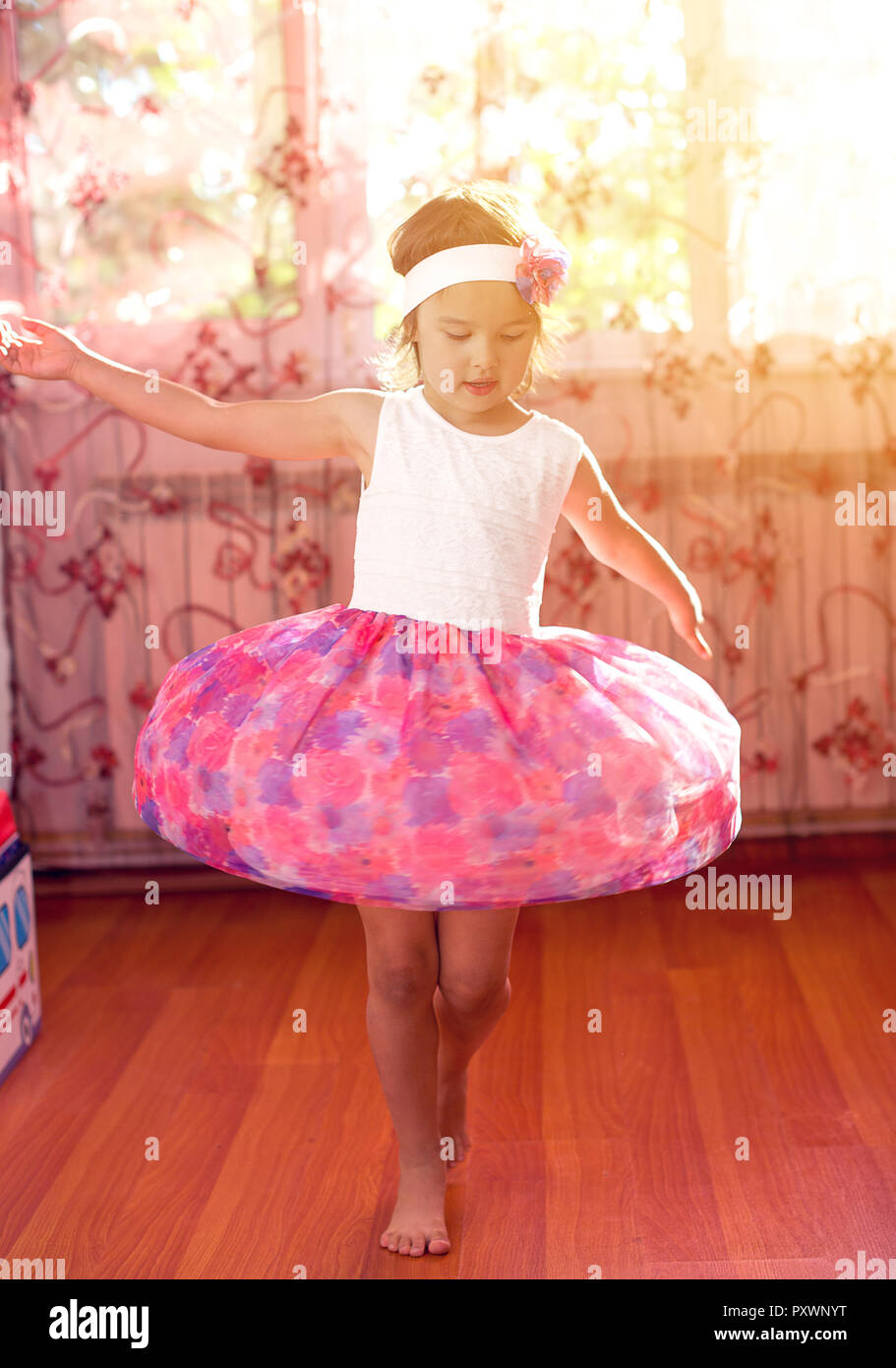 little girl dreams of becoming a ballerina. Child girl in a blue ballet  costume dancing in a room Stock Photo - Alamy