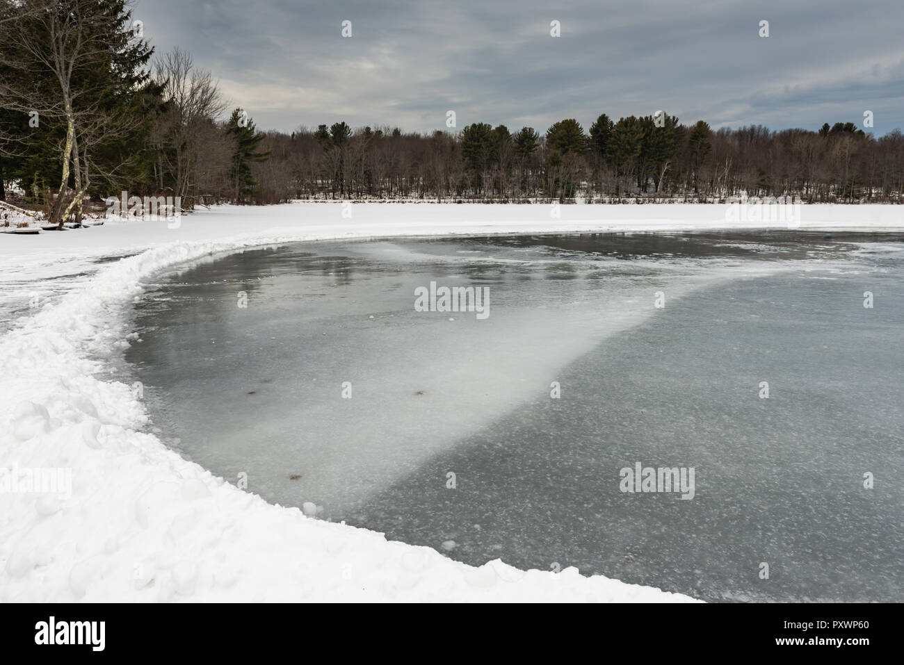 Frozen ice on Mill Pond in Grafton State Park in Grafton, New York