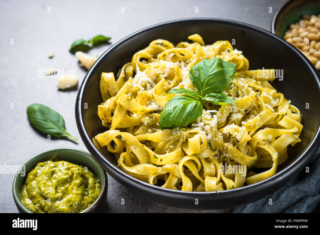Tagliatelle pasta with pesto sauce and parmesan Stock Photo Alamy