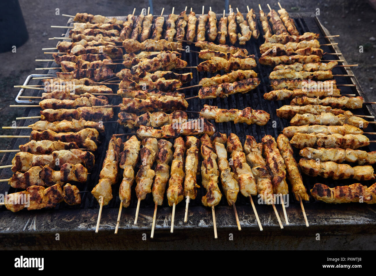 Greek souvlaki.Tasty traditional food from meat of chicken cooking on big  barbecue Stock Photo - Alamy