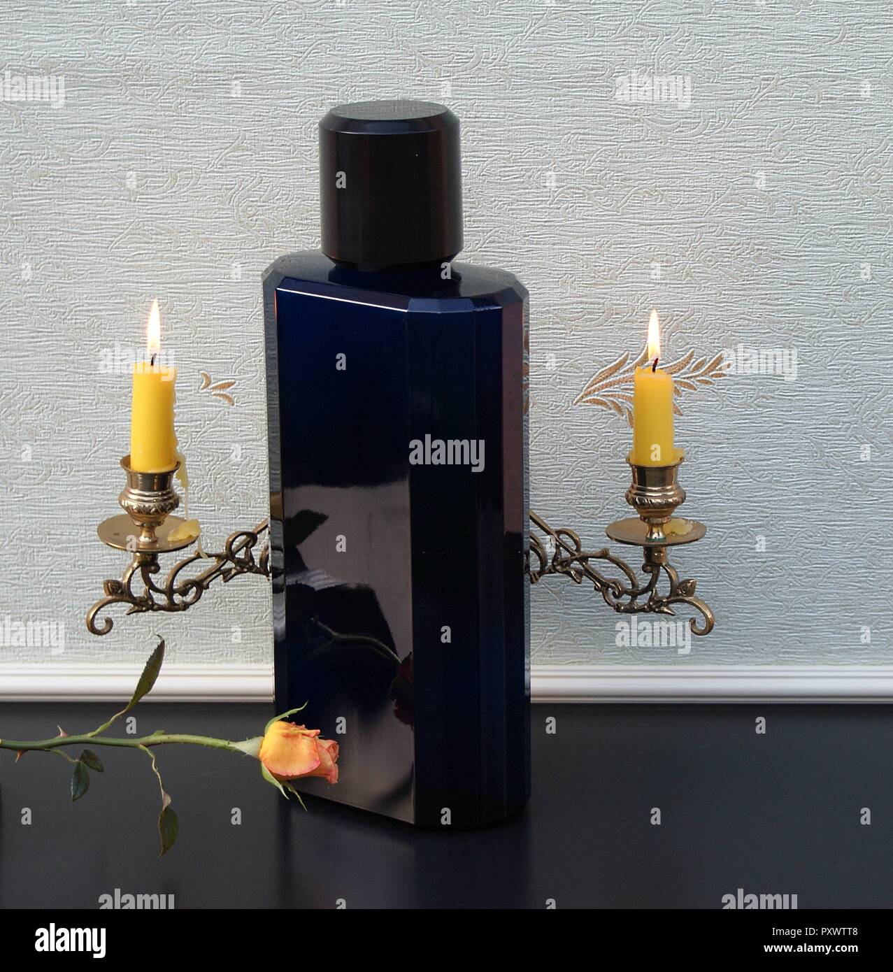 Davidoff Cool Water, Eau de Toilette, large perfume bottle in front of a  piano candelabra with shining candles decorated with an English rose Stock  Photo - Alamy