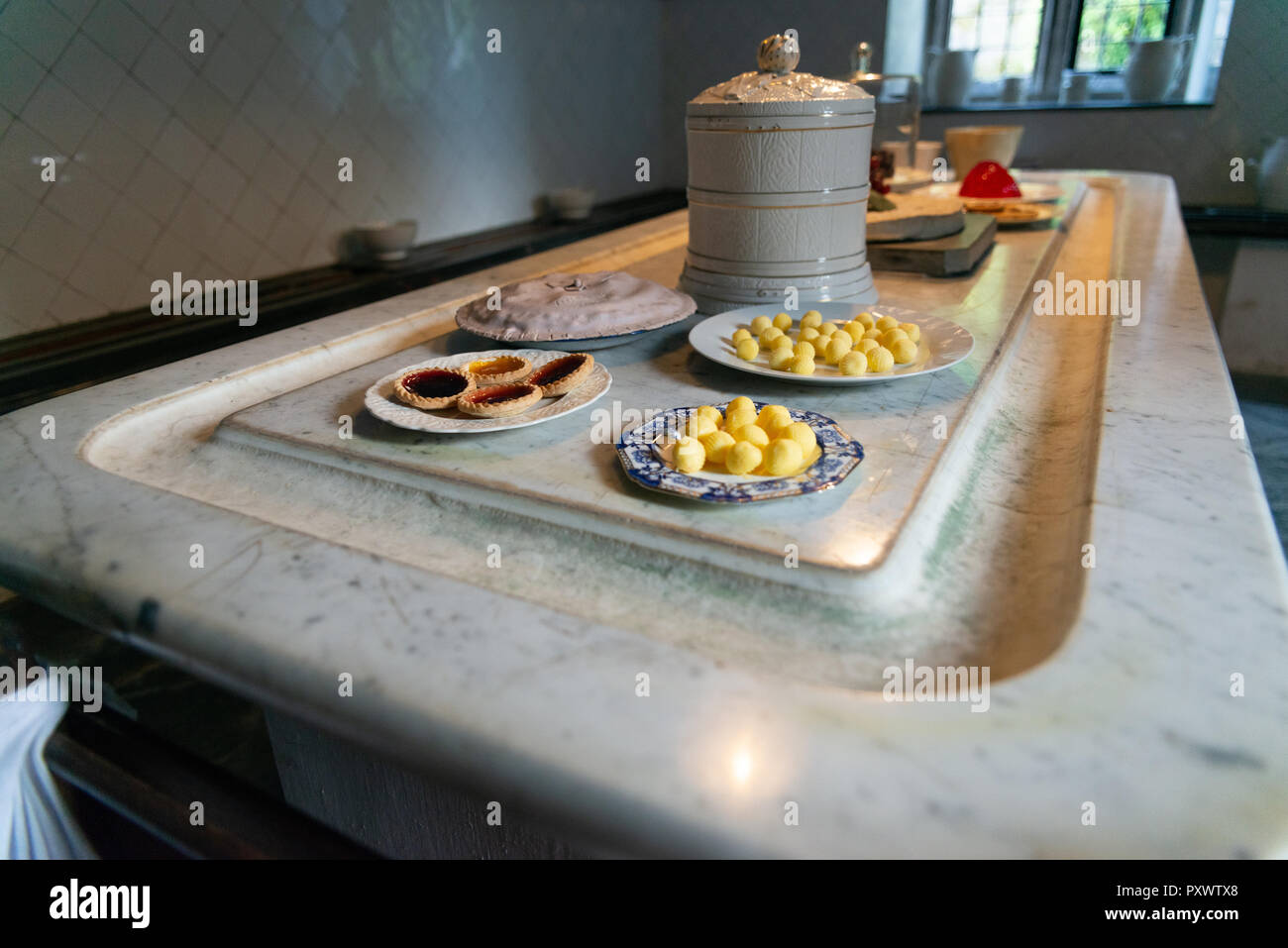 Hand produced and balled butter, tarts, and jellies on a cold marble