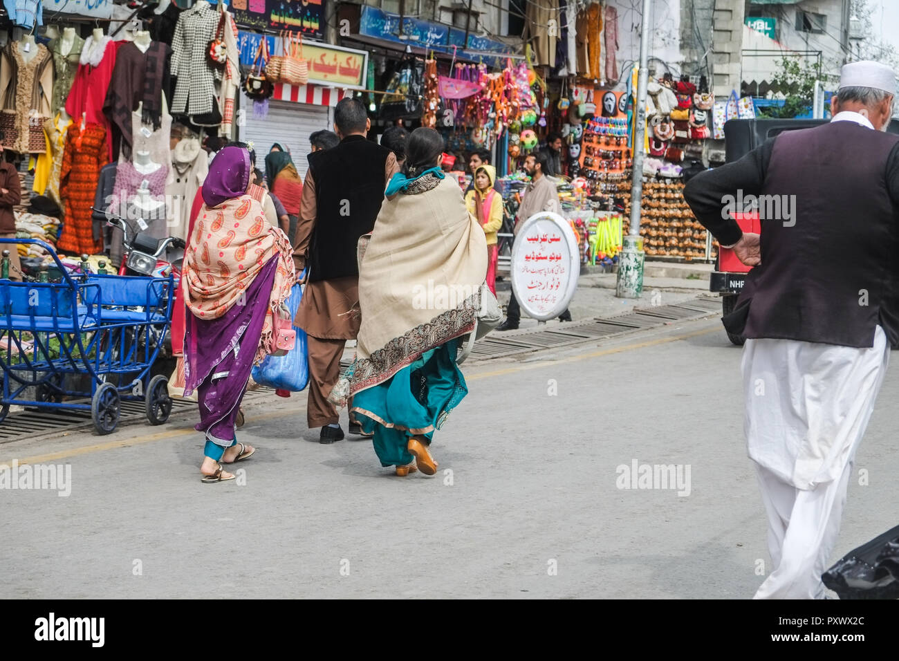 Murree, Pakistan. October 15, 2015 : Pakistani people in traditional dress walking at the shopping street. Stock Photo