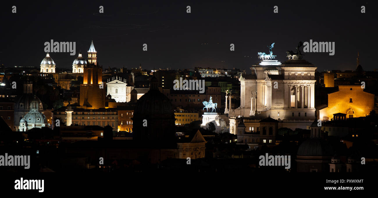 A view from the Janiculum Hill (Gianicolo) in Rome at night, showing the Vittoriano and a number of churches and church domes lit up against the night Stock Photo